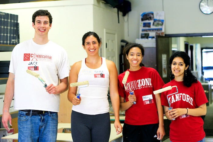 Members of the class of 2012 paint a playhouse during this year’s Beyond the Farm event.